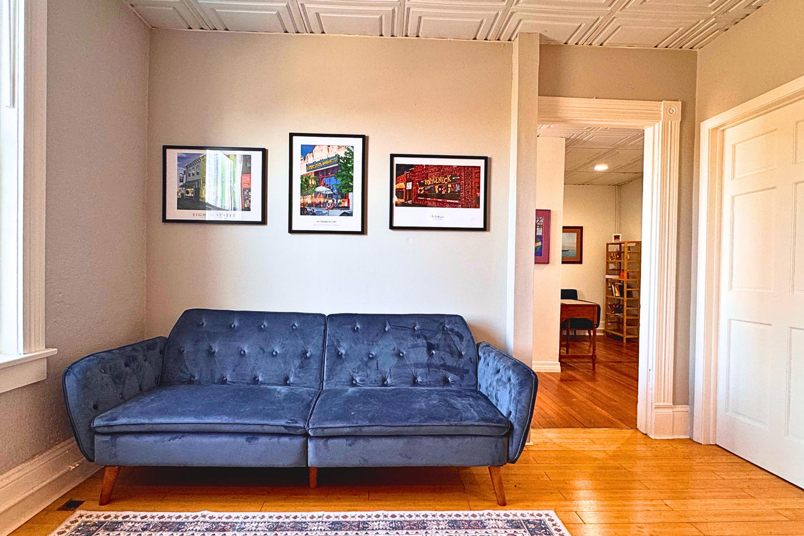 Horizontal Blue Couch in Room From Gray Chairs