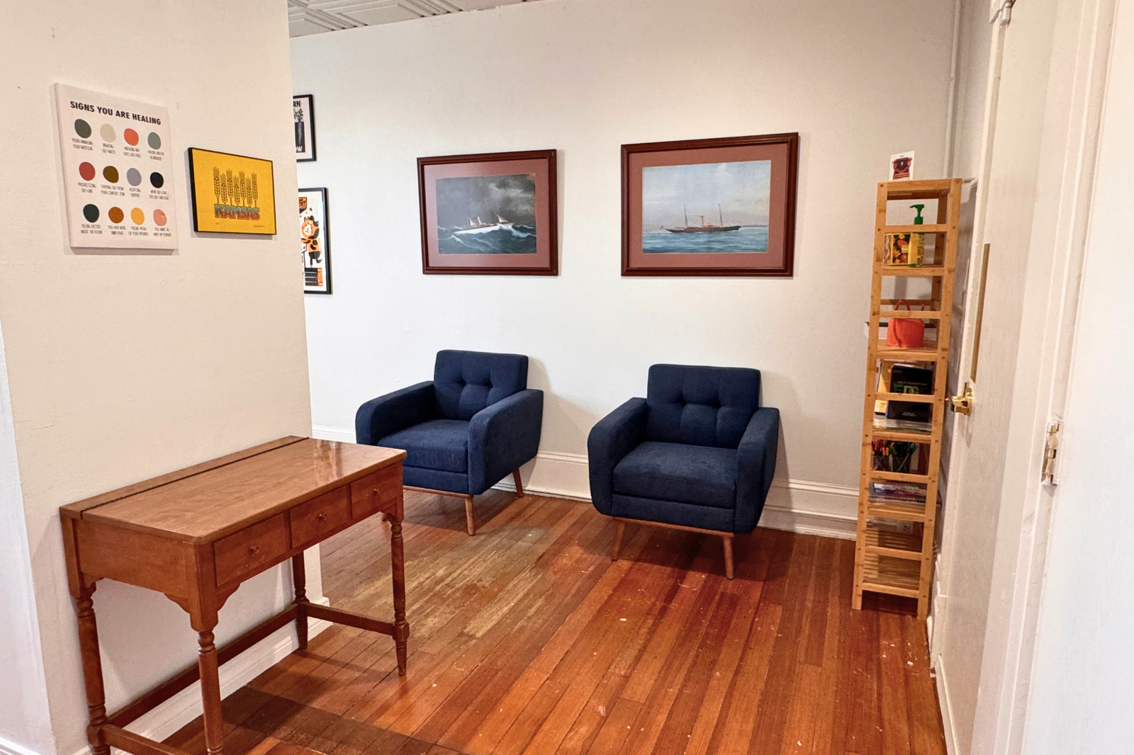 Office Two Blue Chairs Under Pictures